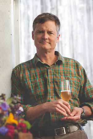 Image of Gordon holding a glass of mead